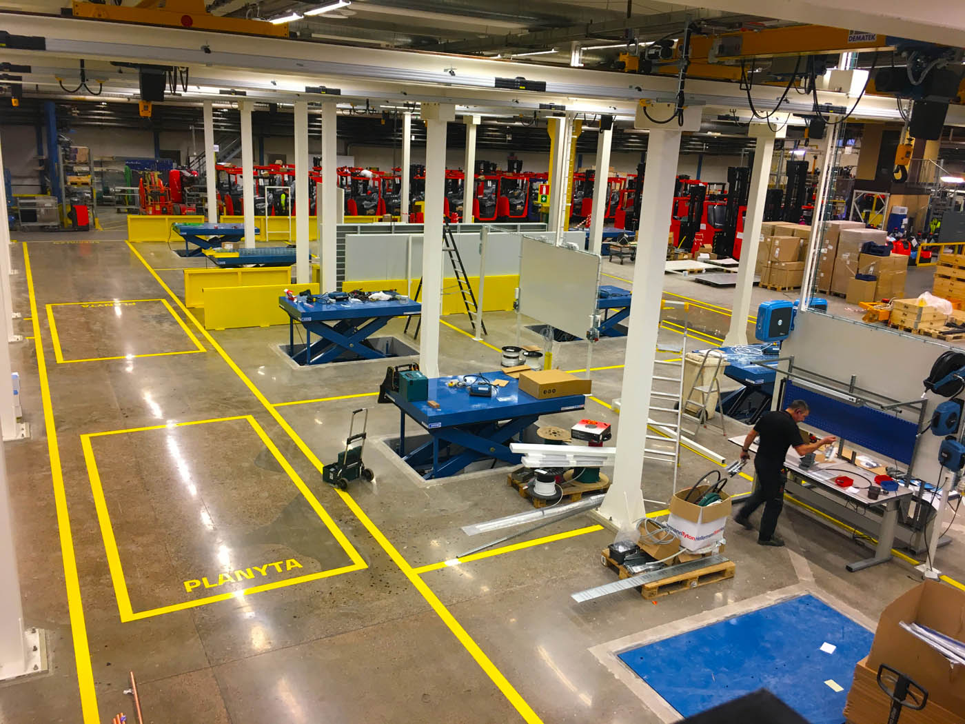The new lift tables and production line in place, making sure that Toyota production flows well and is ergonomically sound.